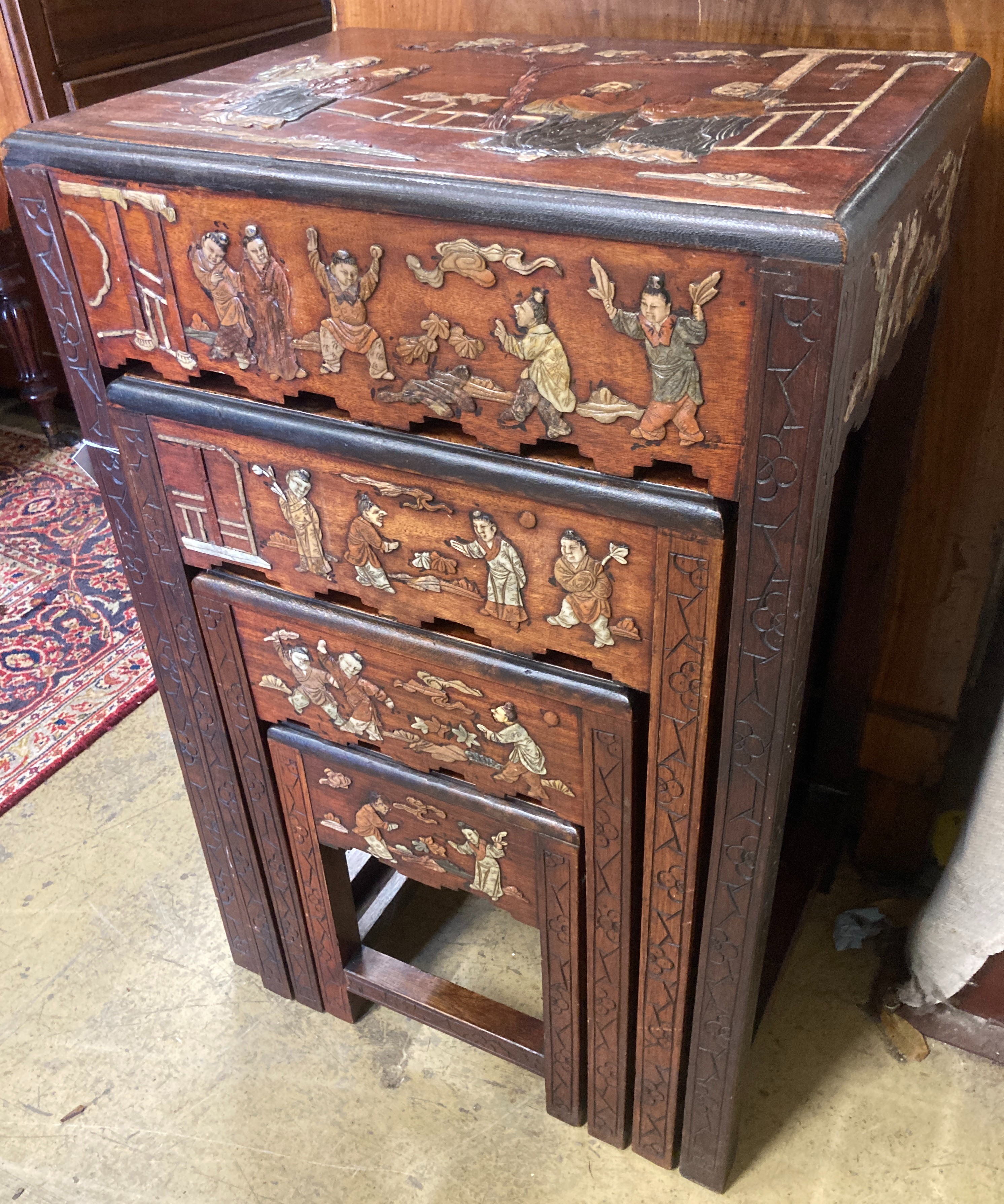 A 1920's Chinese quartetto nest of tables decorated with faux hardstone, width 46cm, depth 34cm, height 72cm